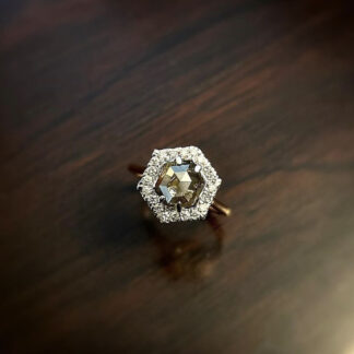 Hexagon salt and pepper ring on a wood table.