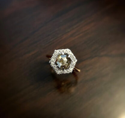 Hexagon salt and pepper ring on a wood table.