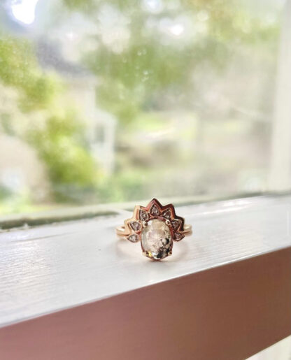 Salt and pepper ring sitting on a window.