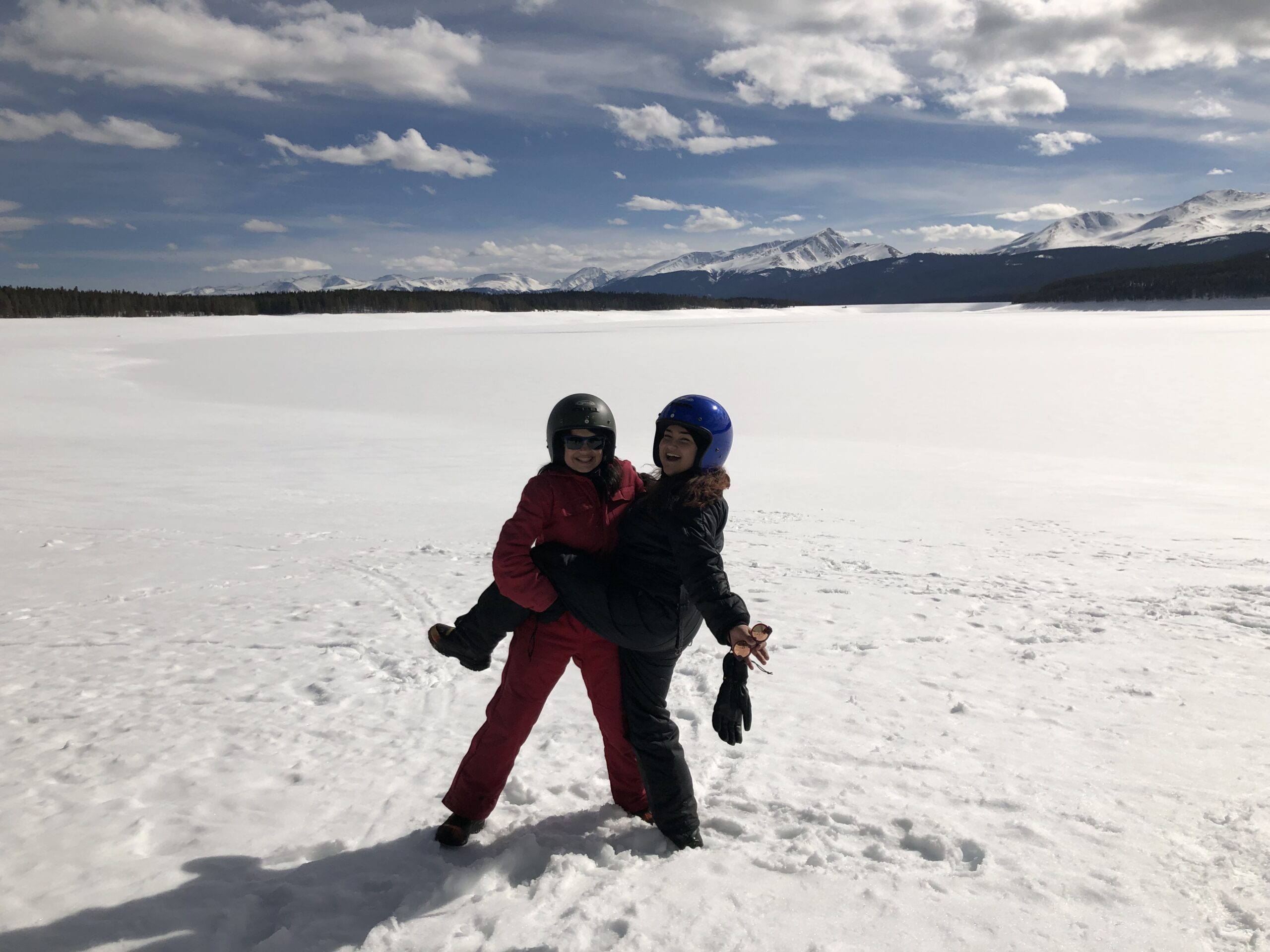 LaMia and her sister in front of a frozen lake in Colorado.