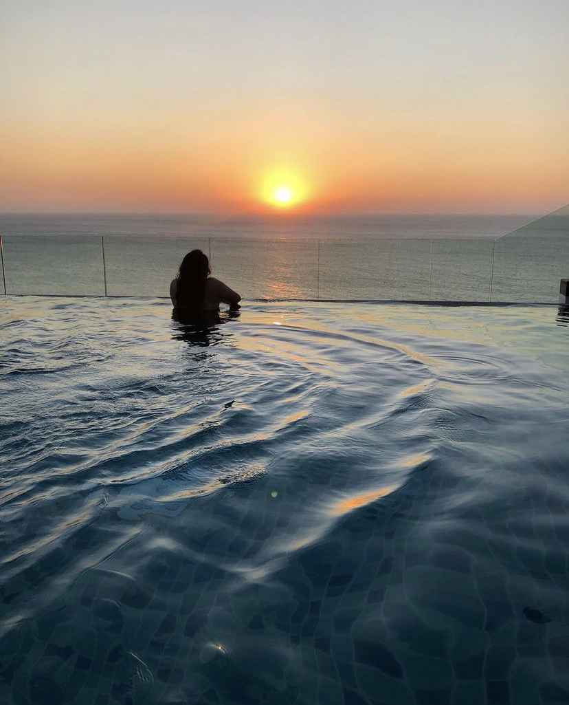 Infinity pool with a beautiful sunset in Sri Lanka.