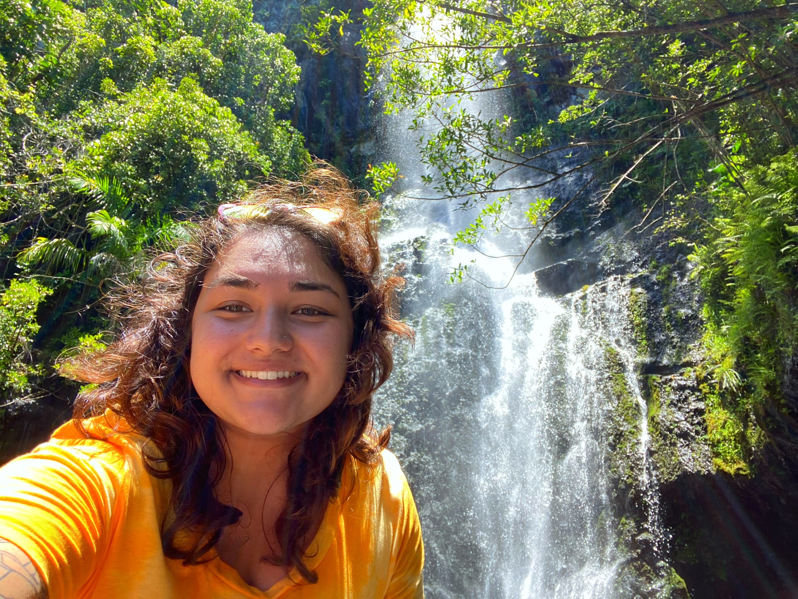 LaMia in front of a waterfall on the Road to Hana, Hawaii.