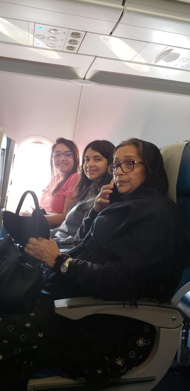 LaMia, her sister Emma, and their grandmother on a plane.